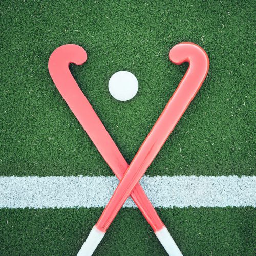 Turf field, hockey stick or sports ball on the ground for fitness competition, exercise contest or